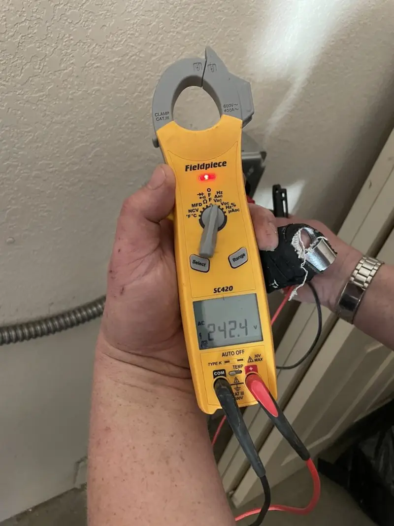 Voltage testing with clamp meter during Electrical Installation Services in Chaparral